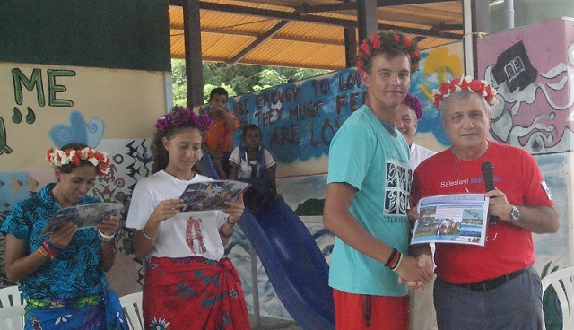 Bishop Luciano handed certificate to them for their achivement they spent here in the SI